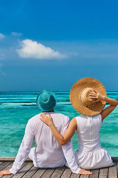 Couple in white on a tropical beach