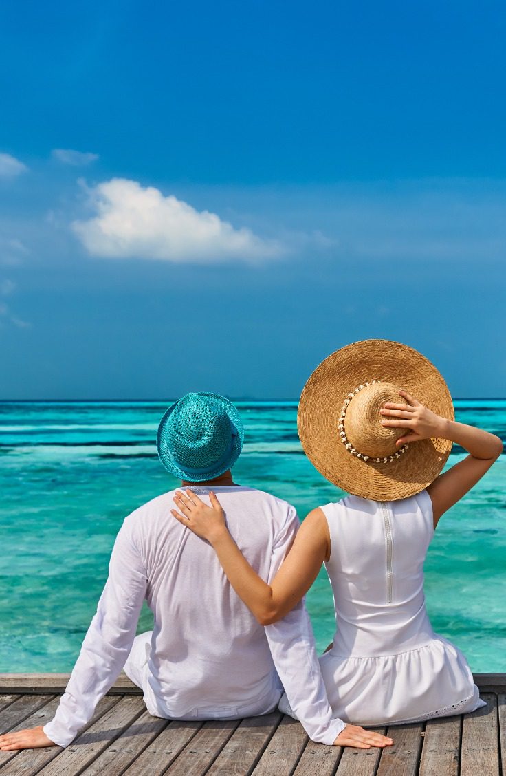 Couple in white on a tropical beach