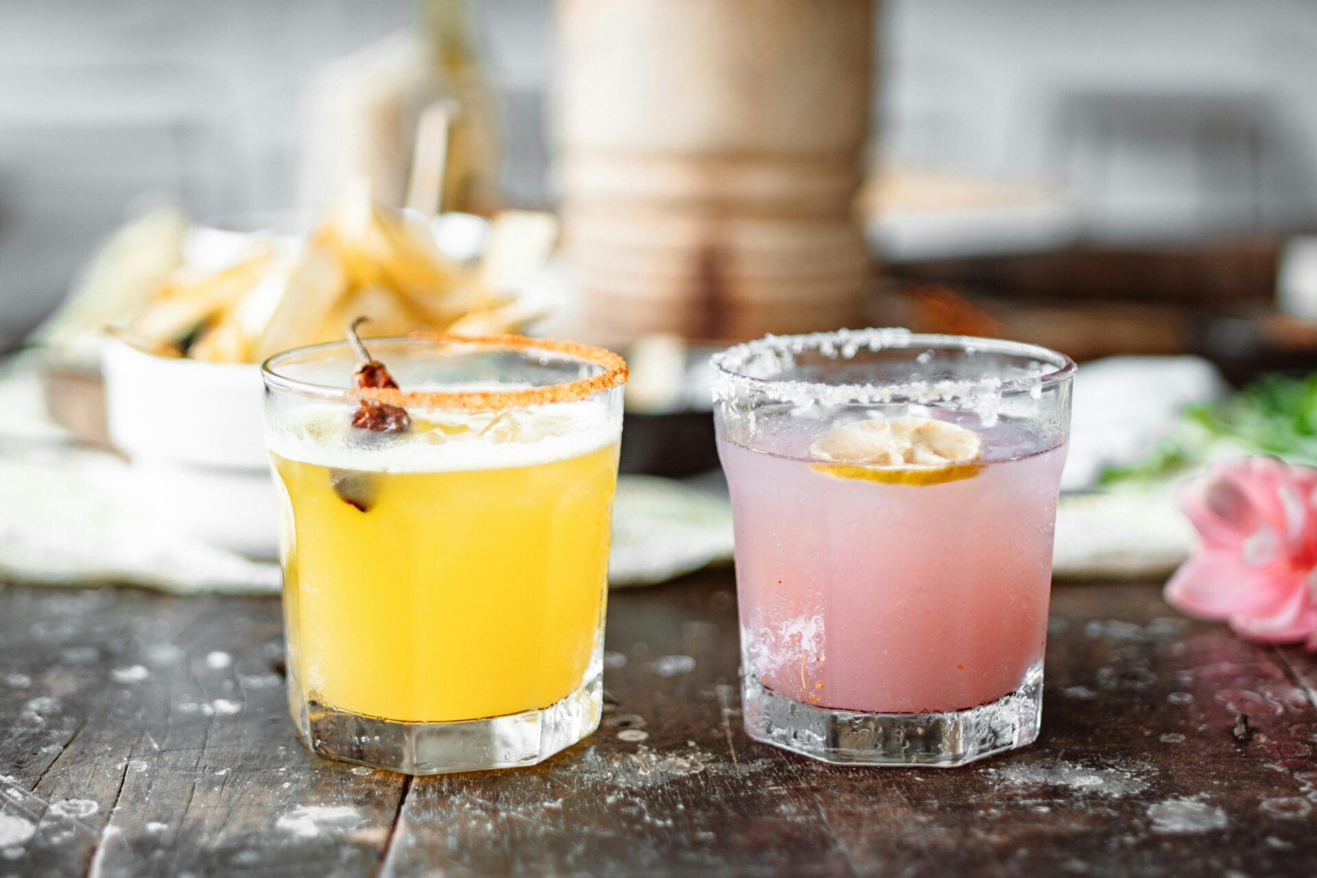 A close-up image of two glasses with tequila.