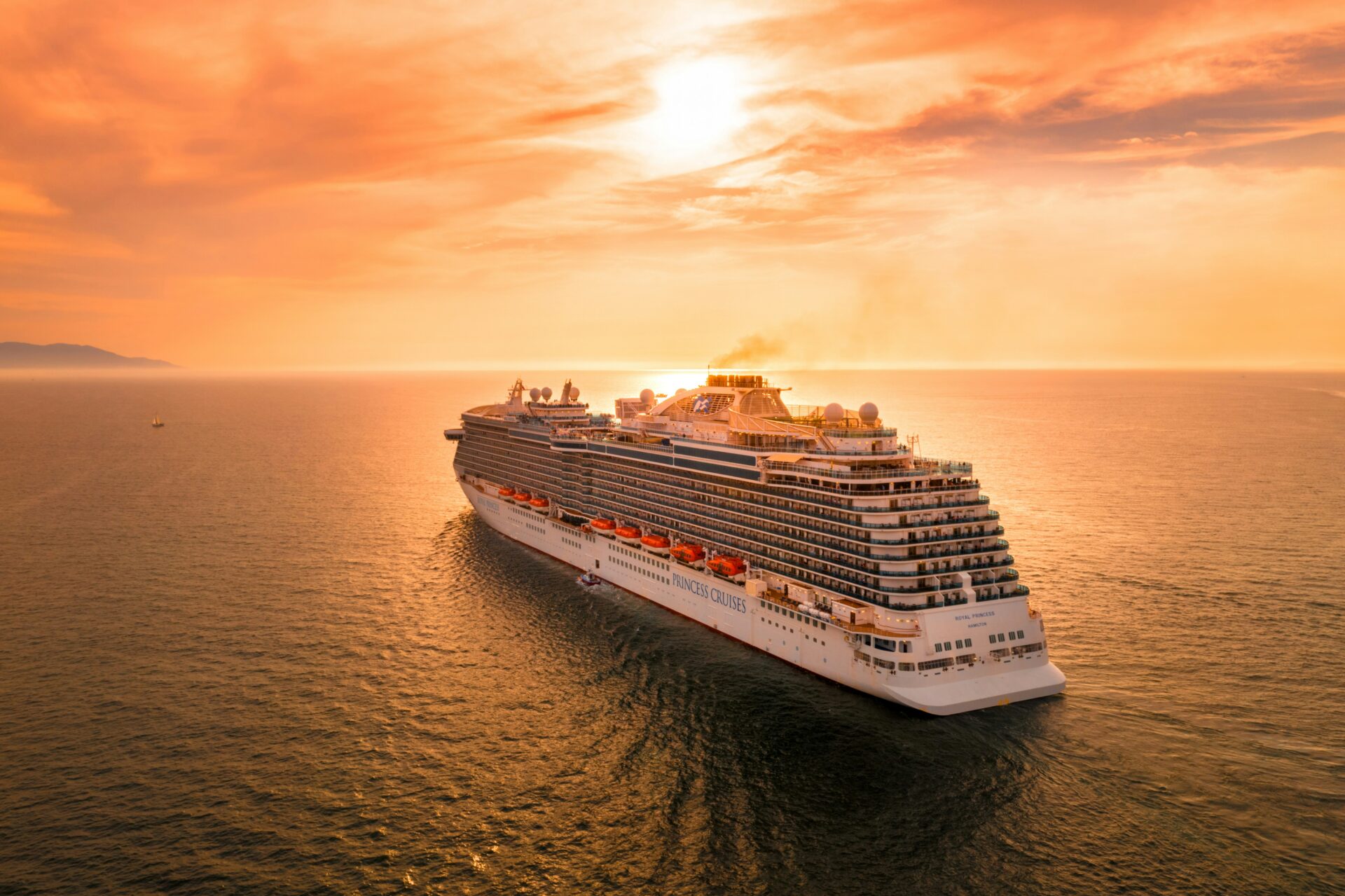 A cruise ship sails the open ocean.